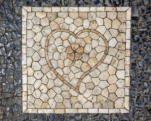 Details of the traditional Portuguese pavement (a heart with a flower inside)