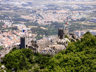 Fototapeta na wymiar Walls of the Moorish Castle and the village of Sintra in the background