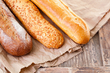 Fresh backed buns on wooden table. Fresh and hot, perfect for your lunch or breakfast.