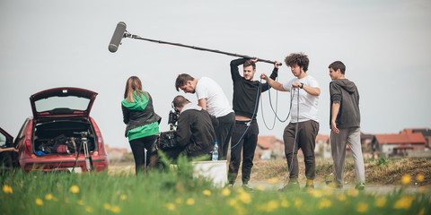 Behind the scene. Film crew filming movie scene outdoor