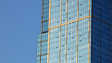Abstract view of office building windows over a blue sky, for business concepts