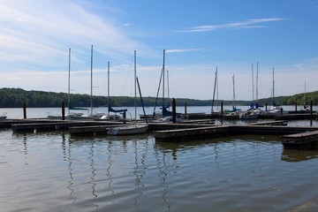 Fototapeta na wymiar The docked boats at the lake on a sunny day.