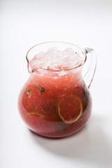 Homemade strawberry lemonade in a glass jug