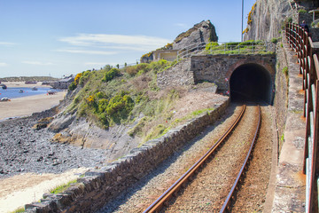 Naklejka premium Railway tunnel besides the beach in Barmouth, North Wales