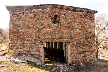 The ruins of an old house in nature