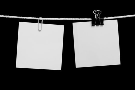 paper note hanging on a rope with clip