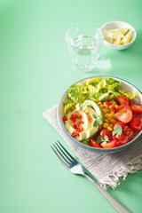 healthy vegan avocado salad with tomatoes and sweetcorn