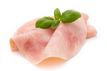 Thin slices of ham on white background.