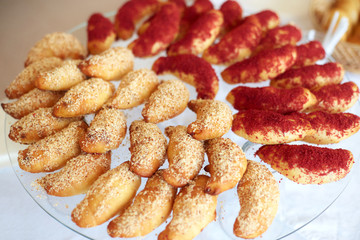 Many fresh buttery croissants on glass stand