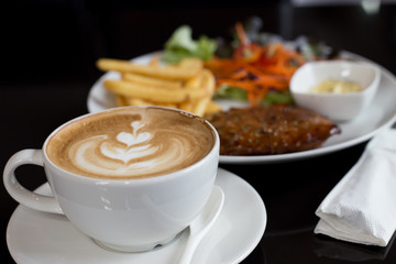Coffee and steak with black background