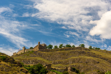 Fototapeta na wymiar Ruins of a castle in Switzerland against blue sky