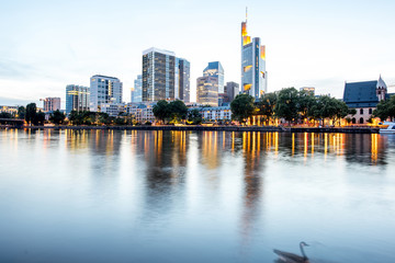 Beautiful cityscape view on the illuminated skyscrapers during the twilight in Frankfurt, Germany