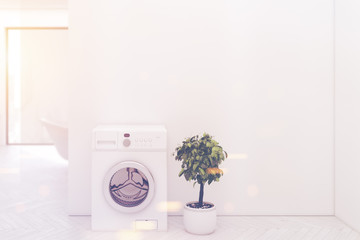 White floor bathroom washing machine closeup toned