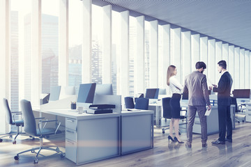 People in an open space office, side, toned