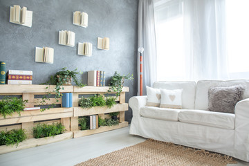 Sofa and bookshelf in room © Photographee.eu