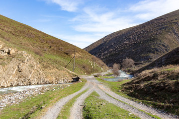 Dirt road in the mountains in the open air