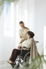 Nurse covering lady with blanket