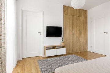 Practical minimalist bedroom TV wall