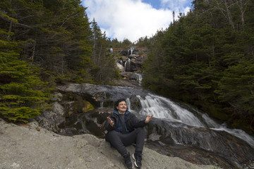 Man in praise looking out from elevation on Mount Washinton via Ammonoosuc ravine trail