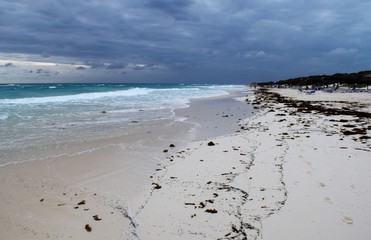 Paradise beach,Cuba. View of a perfect desert coast with withe sand and blue turquoise sea in a cloudy day