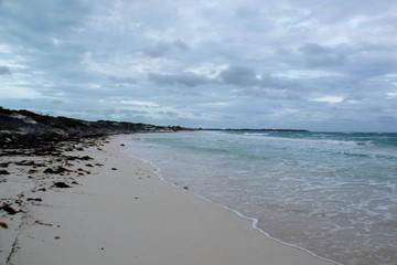 Rocky coast at a white sand beach, Cayo Largo, Cuba