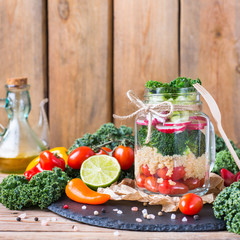 Healthy vegan salad in a mason jar with quinoa