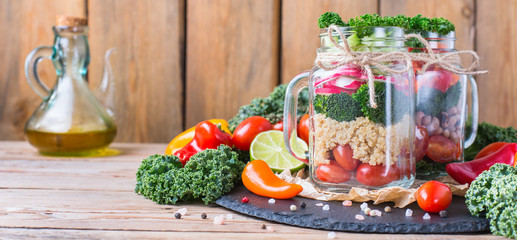Healthy vegan salad in a mason jar with quinoa