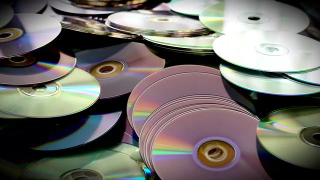 Cds and Dvds Discs Scattered on the Table