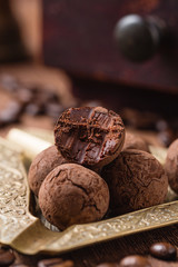 Bitten chocolate truffle in cocoa powder