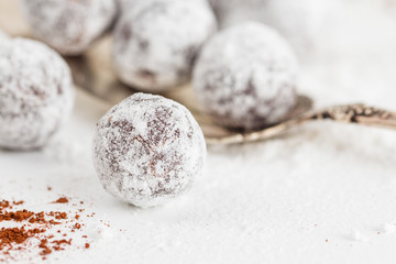 Closeup chocolate truffles with sugar powder