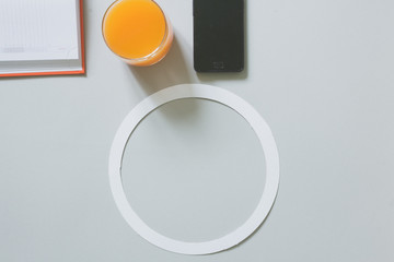 Top view of blank frame on pastel. Colored background office desk with different objects. Minimal flat lay style