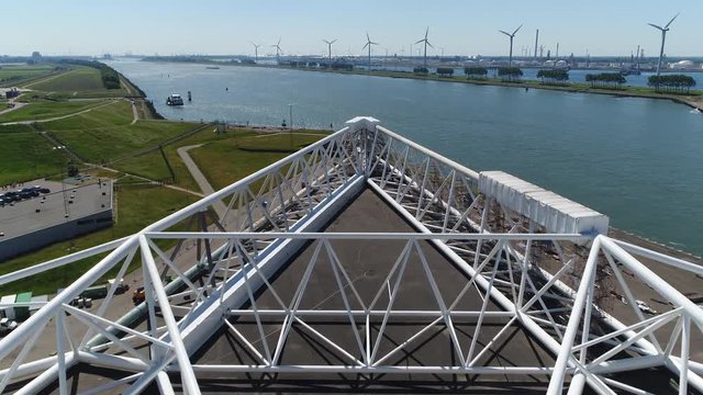 Aerial low flight over on of the arms of Maeslantkering storm surge barrier part of the Delta Works and one of largest moving structures on Earth low altitude flight over Maeslant Barrier arm 4k