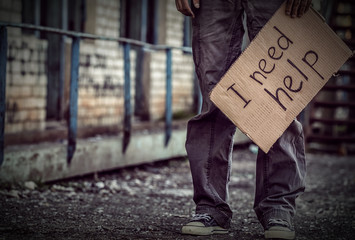 Poor man begging for help on the street