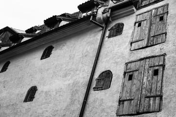 wall of medieval house with wooden blinds in Riga
