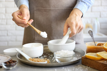 Woman preparing natural body scrub