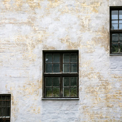 shabby facade of old house in Riga city