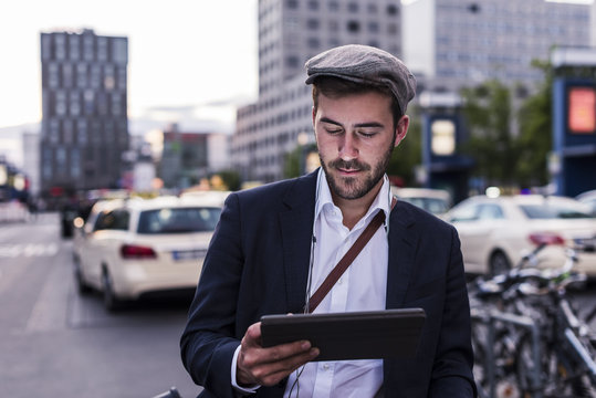 Young man in the city with tablet
