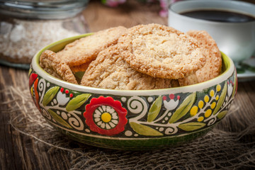 Stack of freshly baked oat biscuits in a bowl.