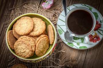Stack of freshly baked oat biscuits in a bowl.