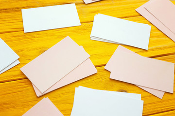 Blank business cards on color wooden background