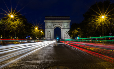 The Arc de Triomphe de l'Etoile (Triumphal Arch of the Star) at Night. It is one of the most famous monuments in Paris, standing at the western end of the Champs-Elyseees.