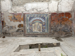 Interior of a room in a Roman villa with a wall mosaic, Herculaneum
