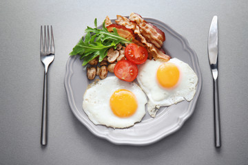 Tasty breakfast with eggs on plate