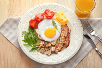 Tasty breakfast with egg on plate