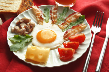 Tasty breakfast with egg on plate