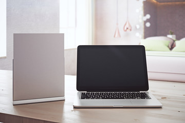 Closeup of paper and laptop