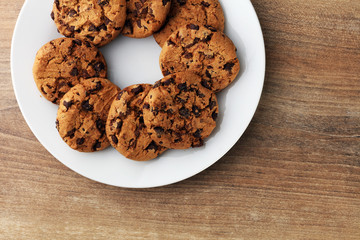 Chocolate cookies on wooden table. Chocolate chip cookies shot