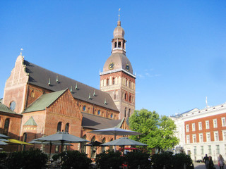 View of Riga Cathedral from local old town square in the morning sun light. Evangelical Lutheran ancient church in Riga, capital of Latvia, popular touristic place