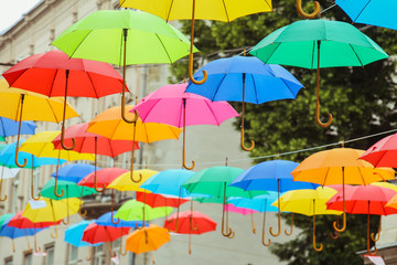 Fototapeta na wymiar Bright colorful umbrellas on the street