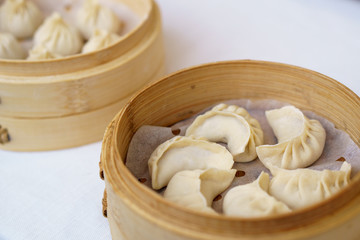 Chinese dumplings in bamboo steamer. Dumplings are among the most typical food in China